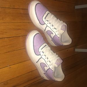 Purple Nike Air Force 1s with a black outline